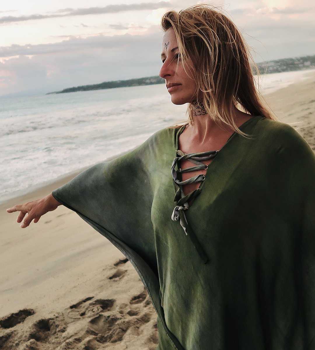 Amandine holding artwork in natural light.