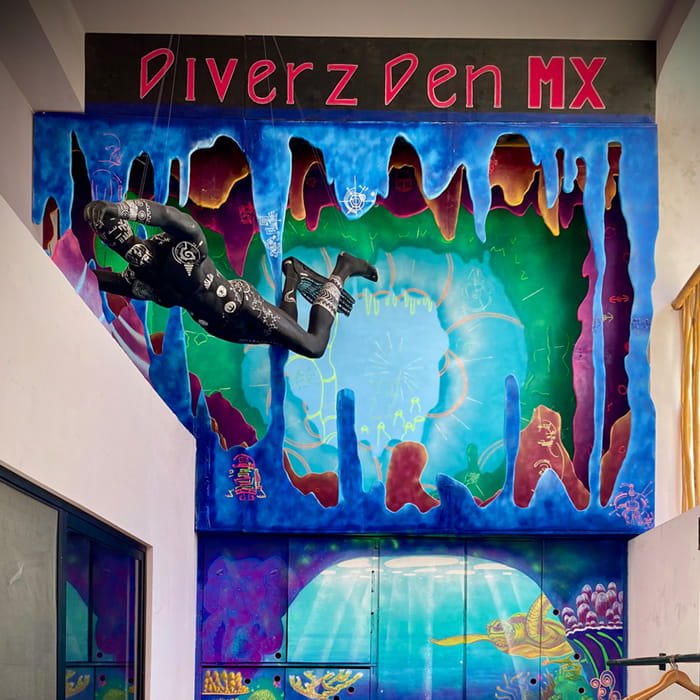 A mural artwork with bold shapes and natural colors.